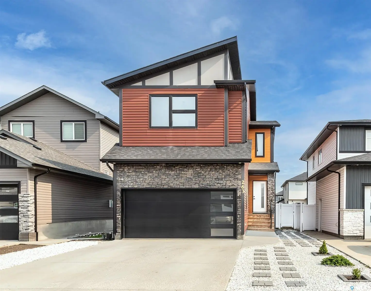 Exterior photo of 263 Barrett Street, Saskatoon, SK, showing a modern two-storey home in Aspen Ridge.